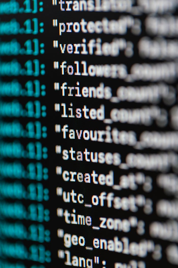 hero-img-01 Extreme close-up of computer code displaying various programming terms and elements.